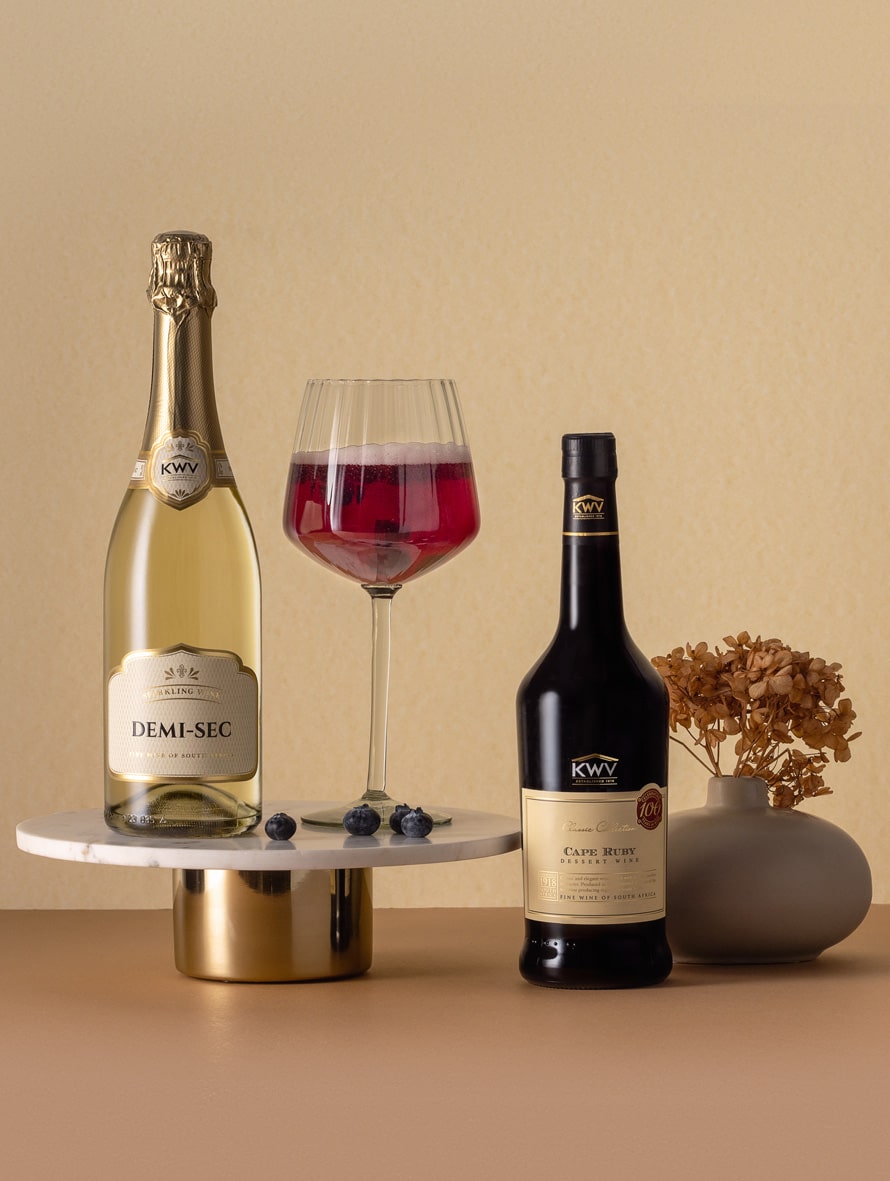 Recipe for KWV Ruby Sparkler
Ingredients:
1 part KWV Classic Cape Ruby dessert wine
4 parts KWV Sparkling Wine
Berries to garnish

Method:
Pour the Cape Ruby into a well-chilled bubbly glass and top up with Sparkling Wine.
To garnish, add a few berries to each glass.

Mixologist’s tip: Feel free to experiment with the amount of Cape Ruby in your cocktail. If you prefer it sweeter, just add more Cape Ruby, or top up with more bubbly if you are looking for a more subtle taste.
 