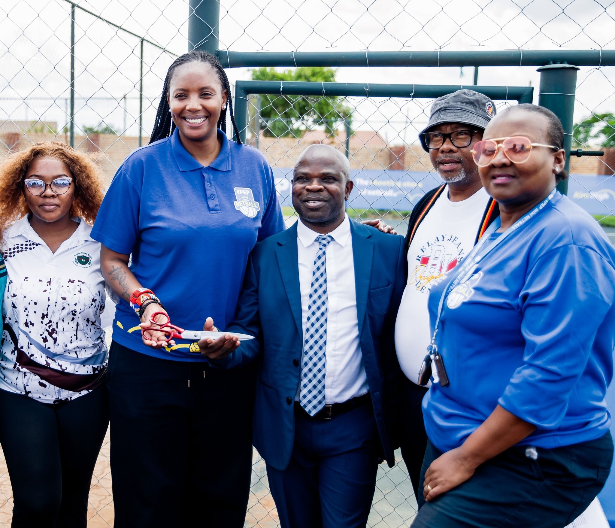 PEP hands over the newly refurbished netball court to Kanana Primary School